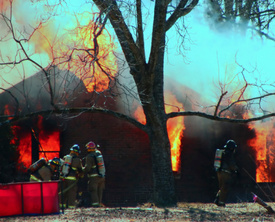 Five firefighters fall through collapsed floor in 3-alarm blaze