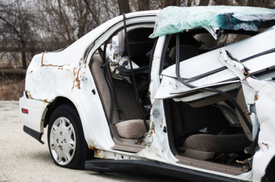 NY motor vehicle accident notice: Driver trapped in car beneath moving semi truck